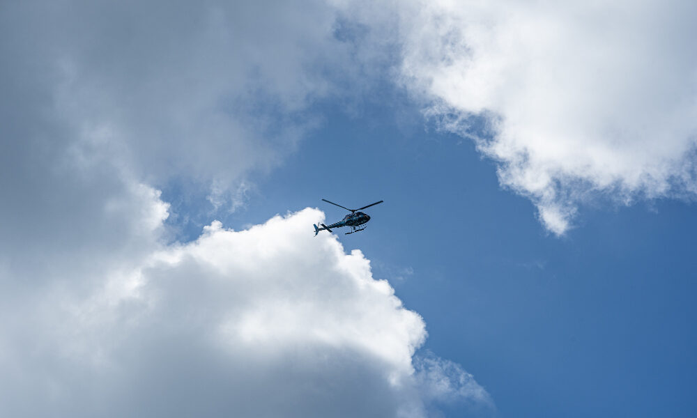 low angle shot helicopter cloudy sky